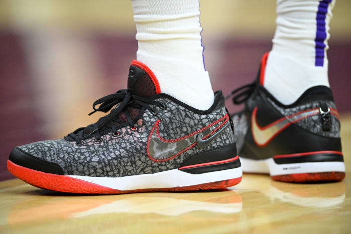A detailed view of black and red Nike LeBron shoes.
